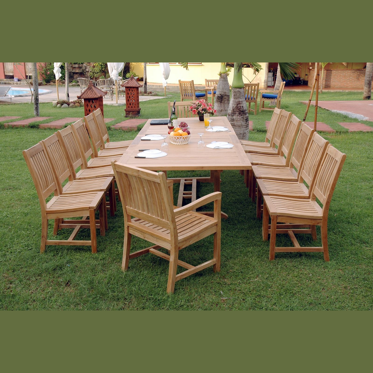 Wooden outdoor dining set with table and chairs on a grassy area