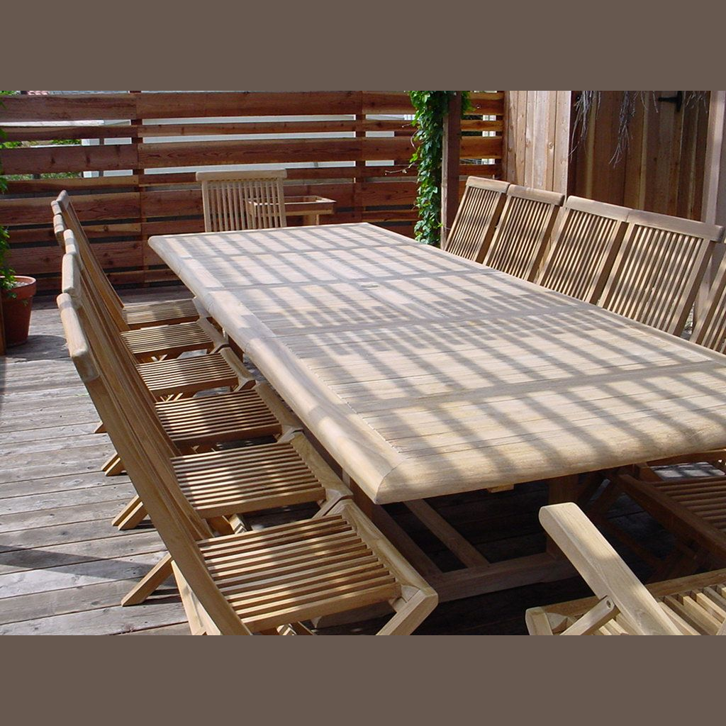 Wooden outdoor table with chairs on a wooden deck