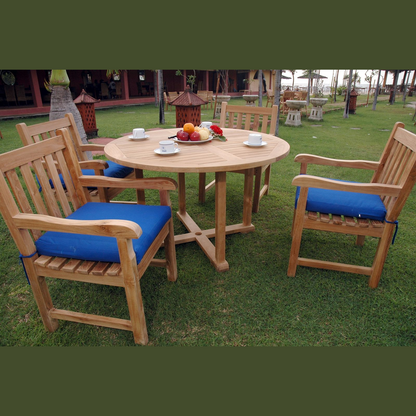 Wooden outdoor table with chairs on a grassy area