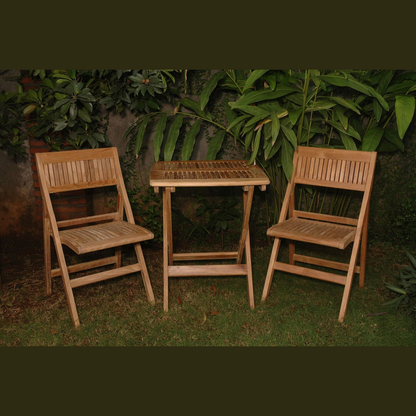 Wooden outdoor furniture set with two chairs and a small table against a green leafy background.