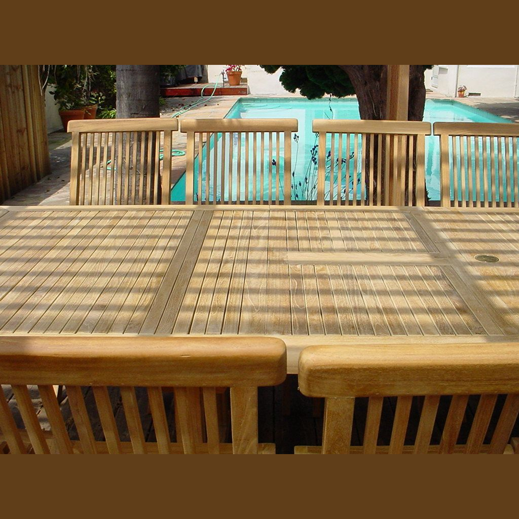 Wooden deck with a pool in the background