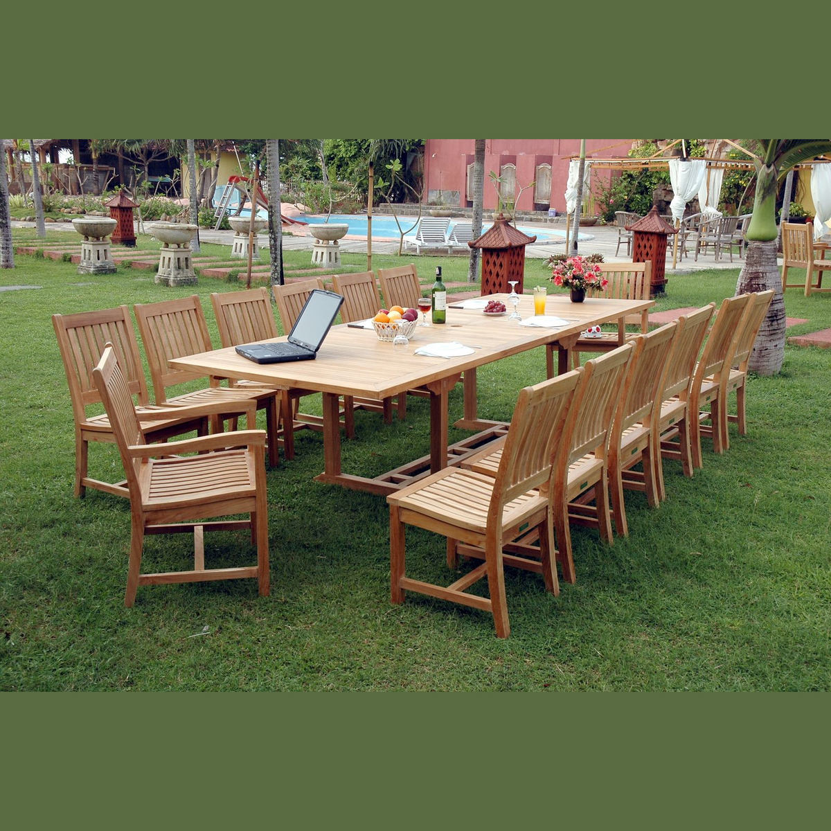 Outdoor wooden dining set with chairs on a grassy area near a pool.