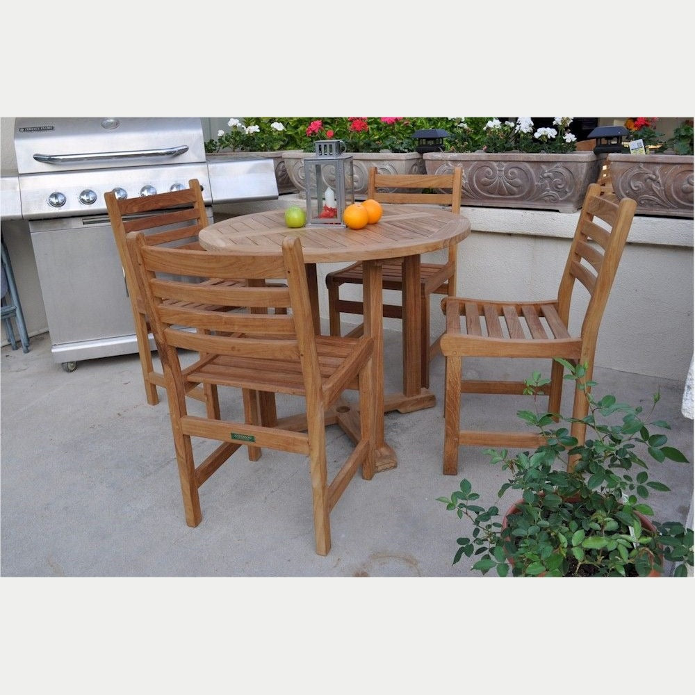 Wooden outdoor table with chairs on a patio