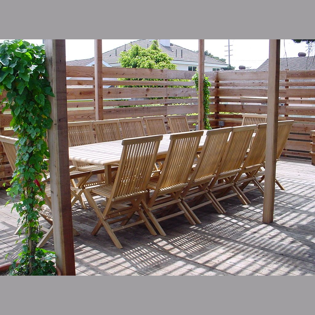 Wooden outdoor dining set with chairs and table on a deck