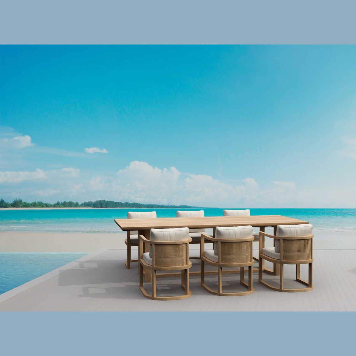 Outdoor dining set with wooden table and chairs on a beach with clear blue sky and ocean.