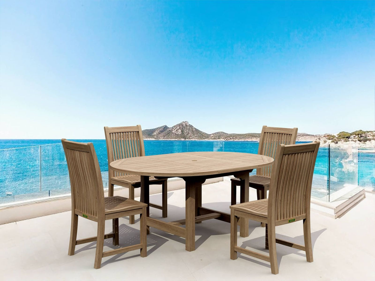 Outdoor dining set with table and chairs on a balcony with a scenic view of water and mountains.