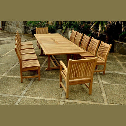 Wooden outdoor dining table with chairs on a stone patio