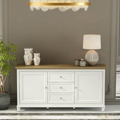 White sideboard with wooden top in a room with striped wallpaper and a chandelier.