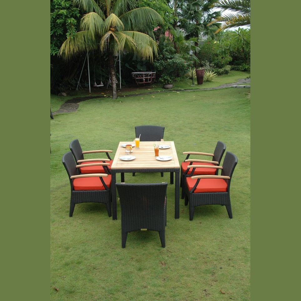 Outdoor dining set with table and chairs on a grassy area with palm trees in the background