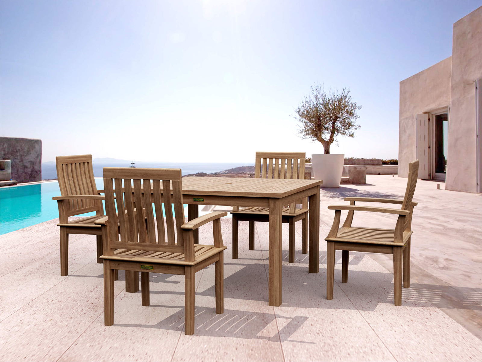 Wooden outdoor dining set with table and chairs on a patio with pool and ocean view.