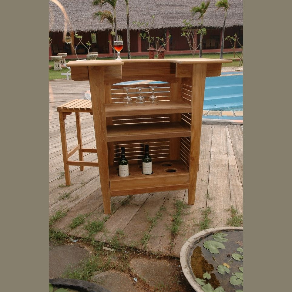 Wooden outdoor bar cart with bottles and glasses on a wooden deck.