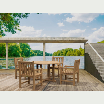 Wooden outdoor dining set on a deck with a view of a lake and trees.