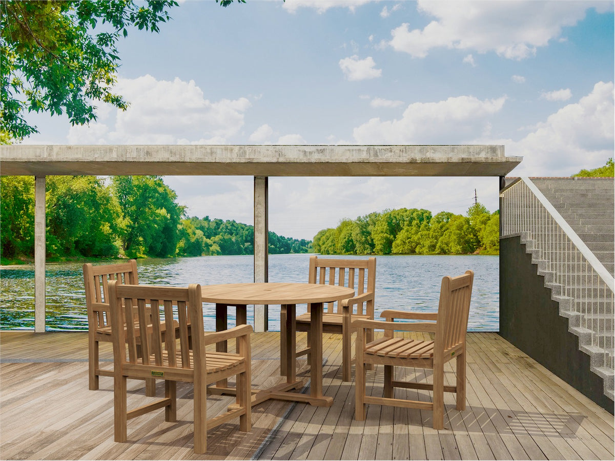 Wooden outdoor dining set on a deck with a view of a lake and trees.