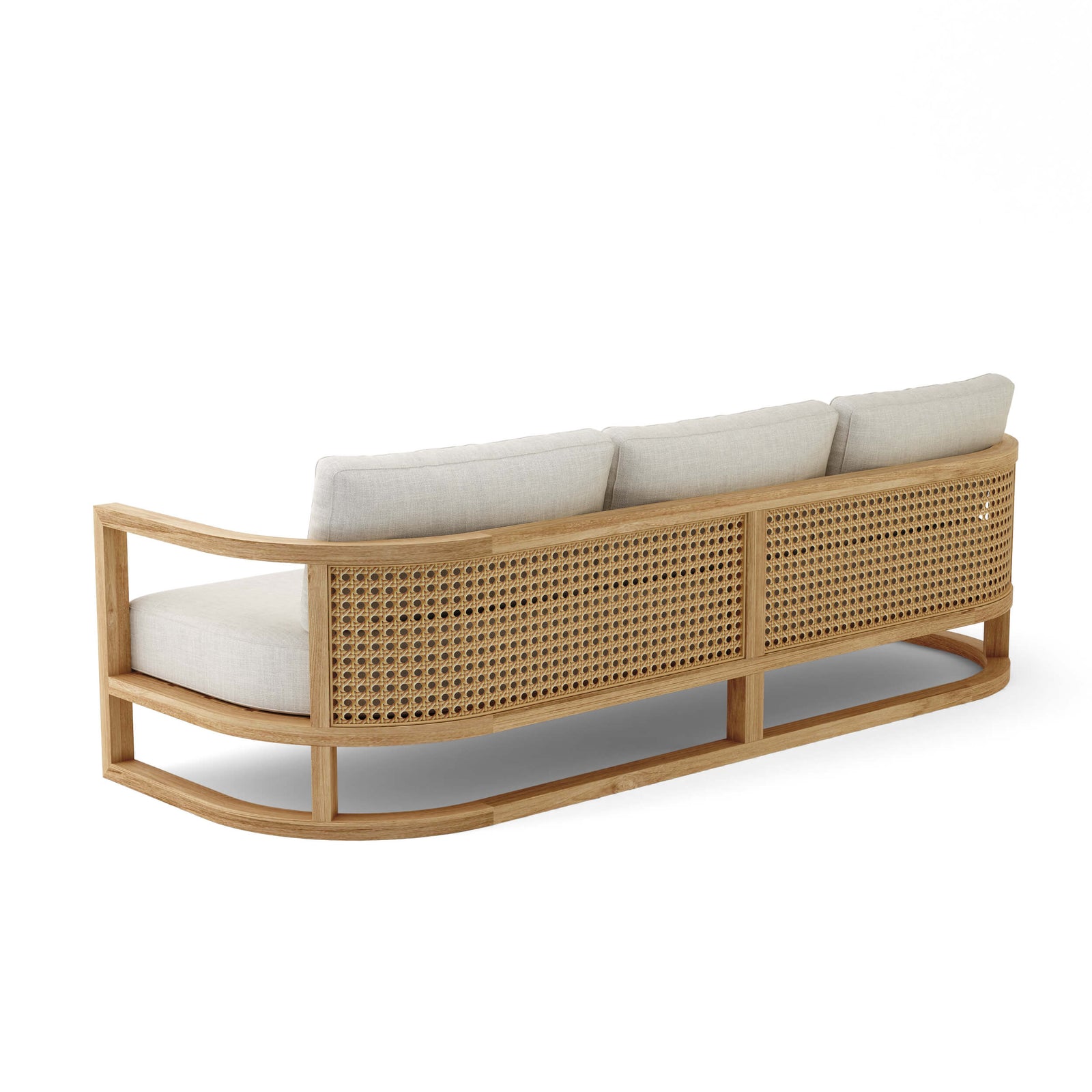 Wicker outdoor sofa with white cushions on a white background