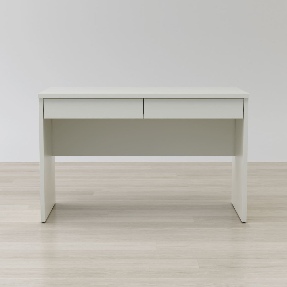 White desk with a light gray panel on a wooden floor and white wall background