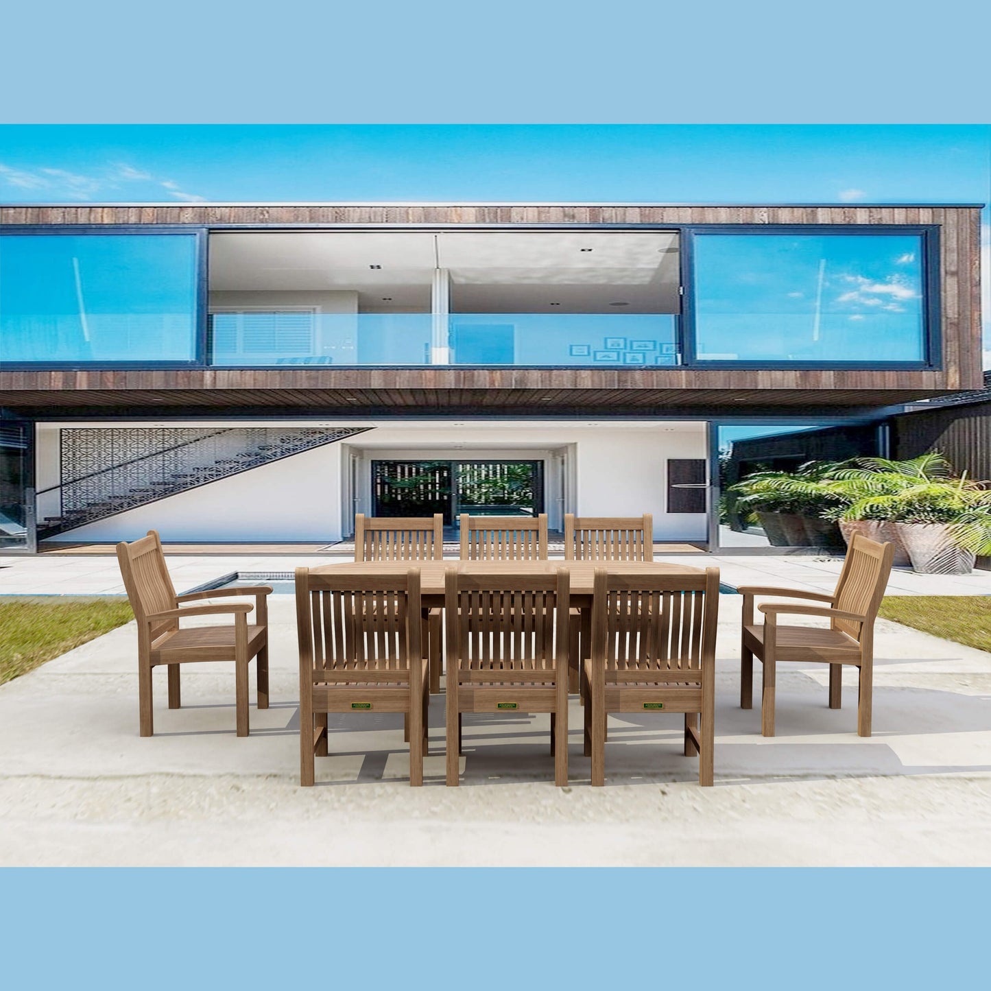 Wooden outdoor dining set in front of a modern house with large windows.