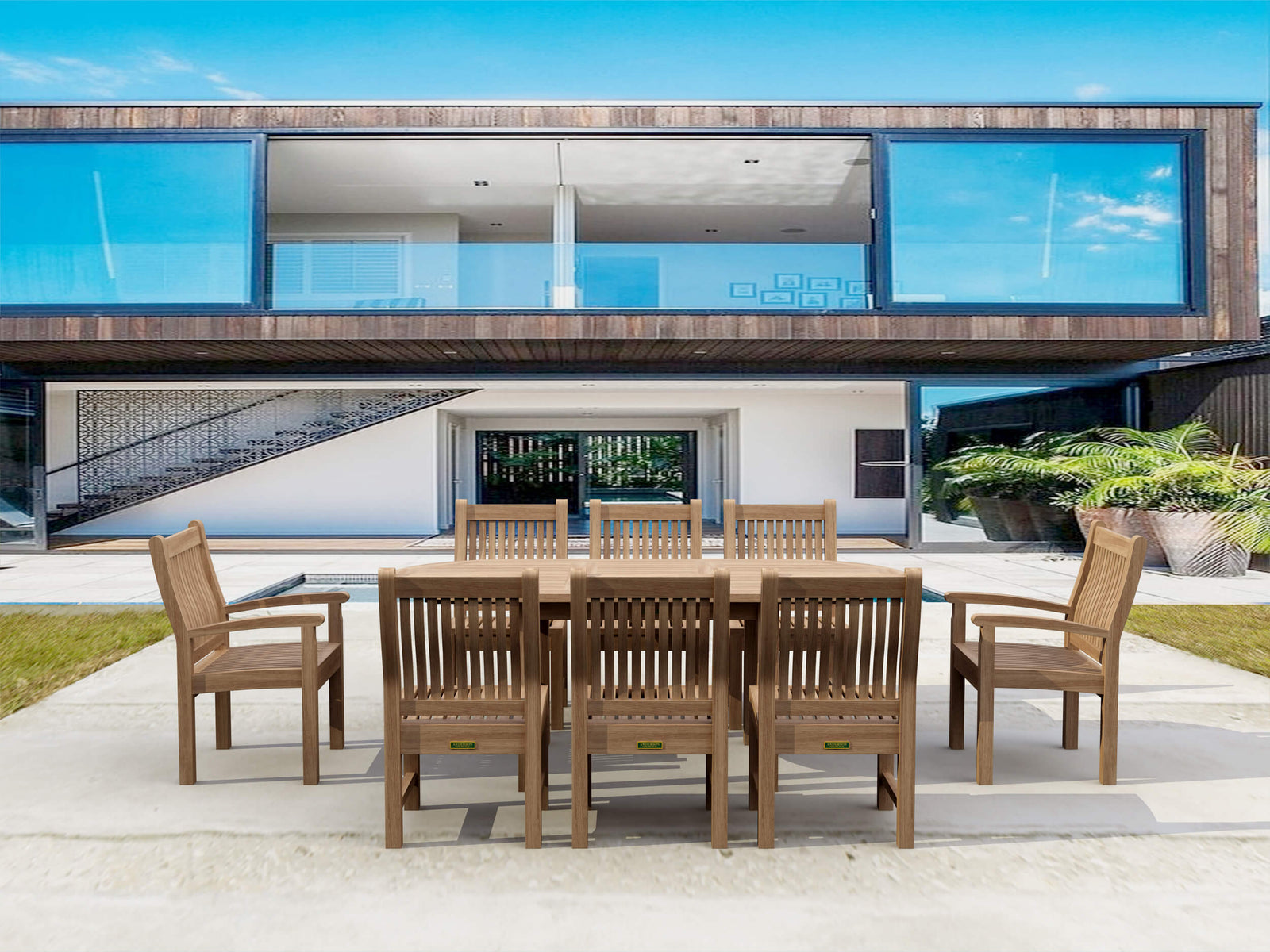 Wooden outdoor dining set in front of a modern house with large windows.