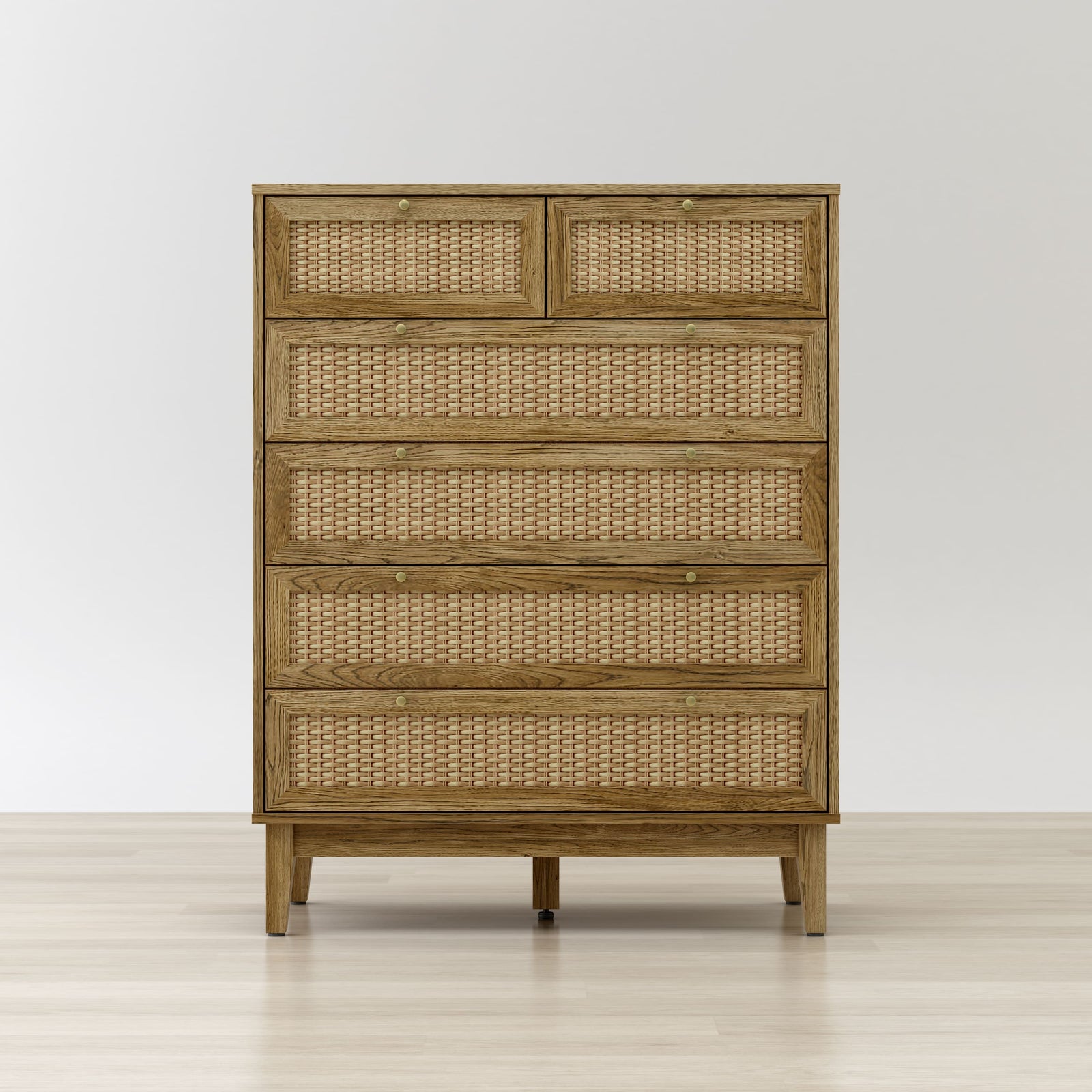 Wooden dresser with wicker-like drawer fronts on a white background