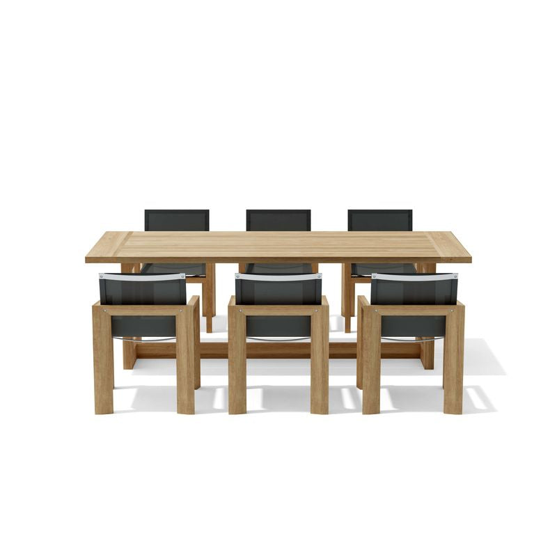 Wooden dining table with six matching chairs on a white background