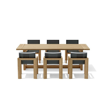 Wooden dining table with six matching chairs on a white background