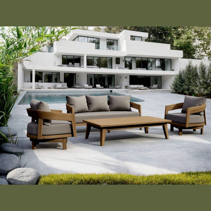Outdoor patio set with wooden furniture in front of a modern house.