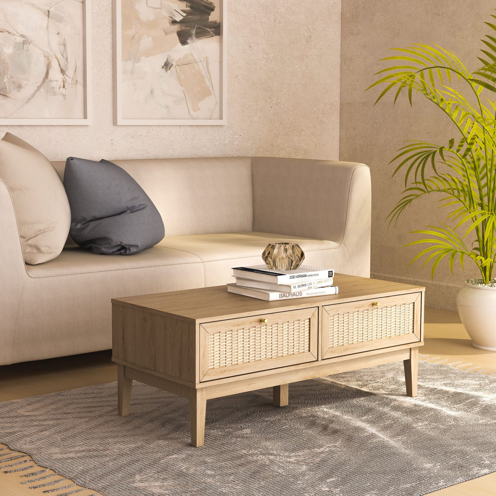 Beige sofa with a coffee table and decorative items in a living room setting.