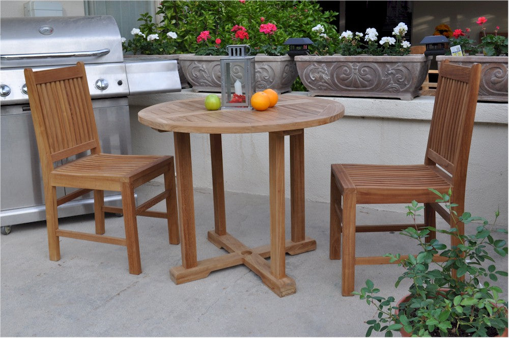 Wooden outdoor table with chairs on a patio
