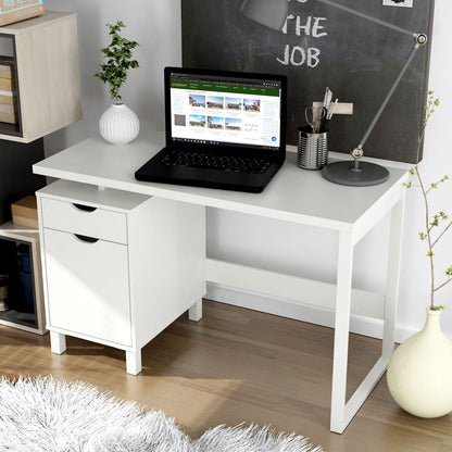 White desk with a laptop, office supplies, and a chalkboard wall in a home office setting.