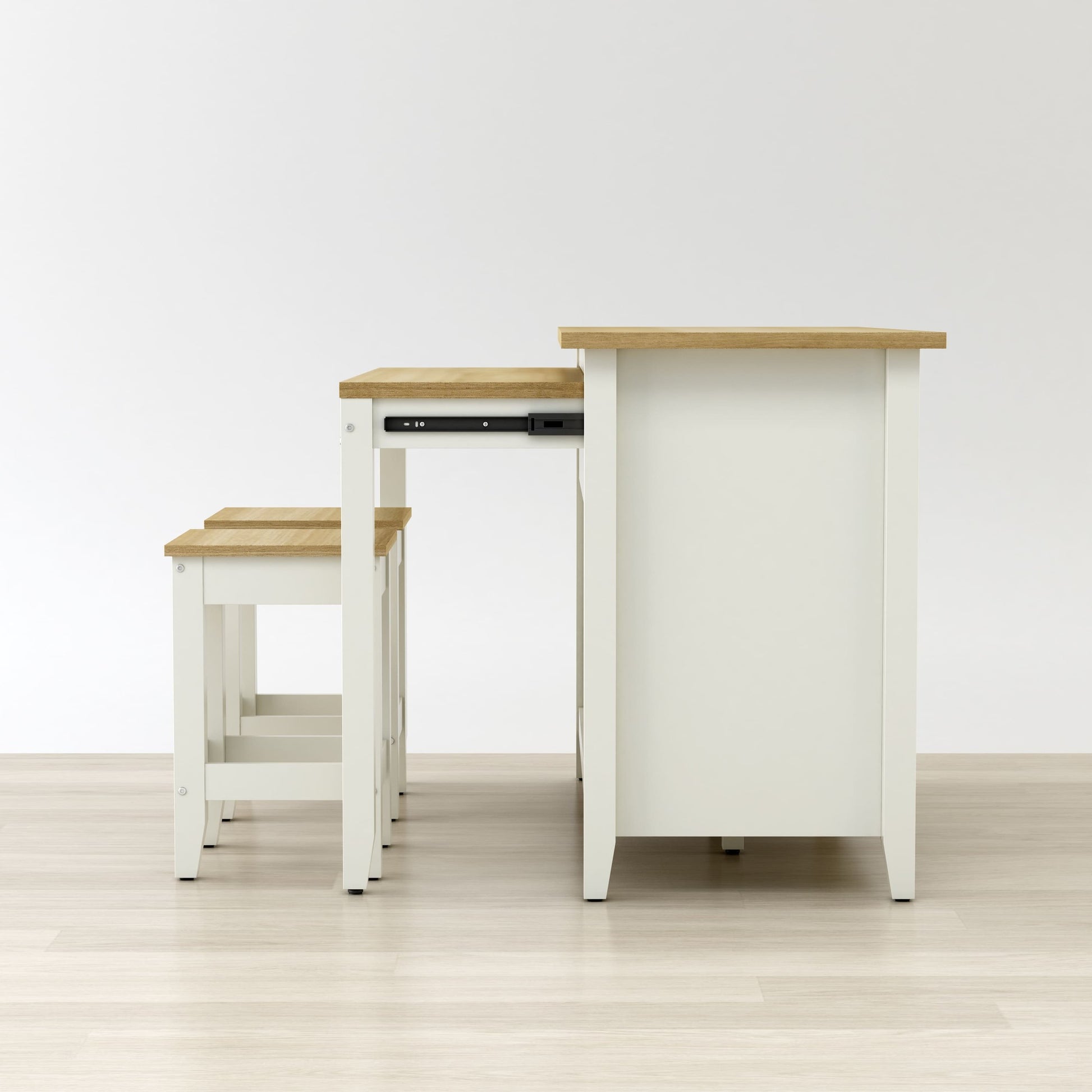 Set of white tables with wooden tops on a light wood floor.