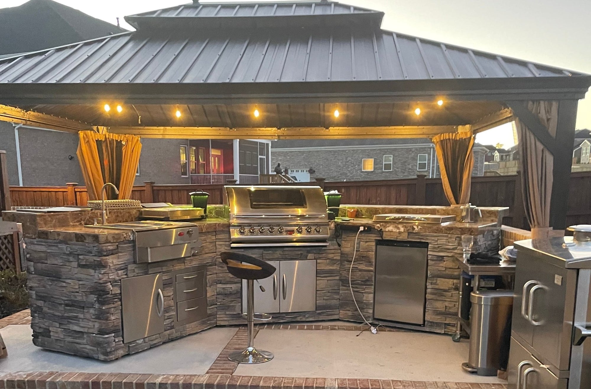 Cal Flame 15 foot Grand Pavilion BBQ island with bar seating for 8