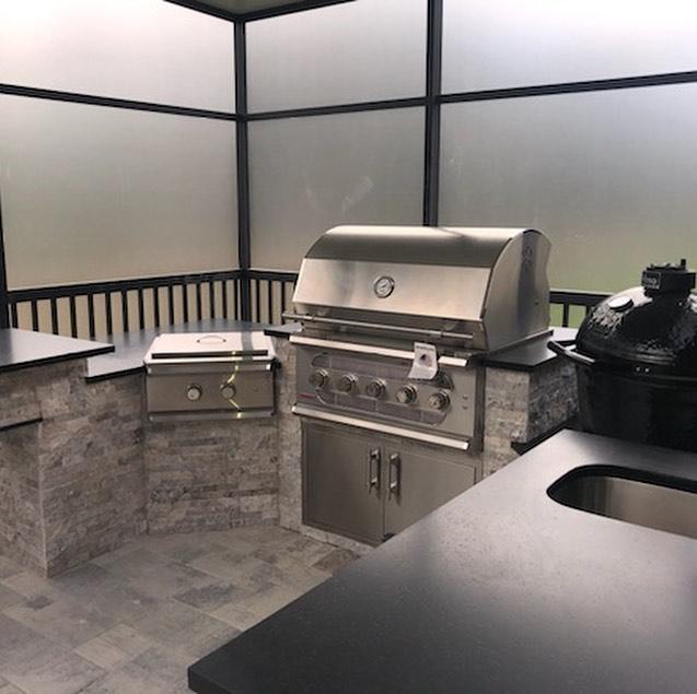 https://betterpatio.com/cdn/shop/products/dramatic-and-sleek-silver-travertine-kitchen-absolute-black-granite-privacy-glass-bold-outdoor-living-in-florida_1024x1024.jpg?v=1638906901